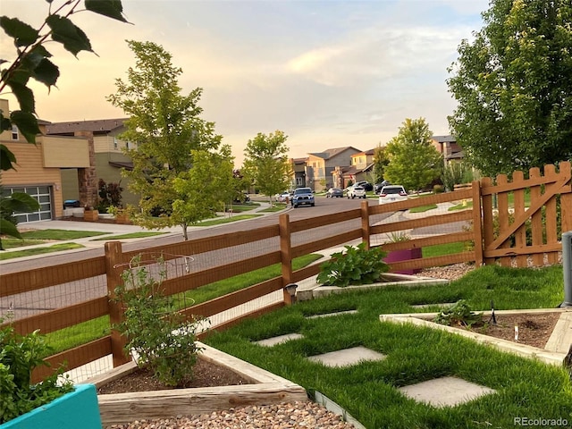 view of yard at dusk