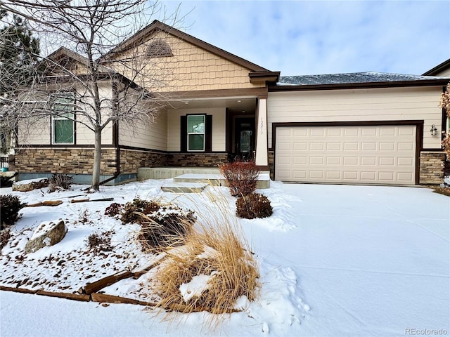 view of front of house with a garage, stone siding, and driveway