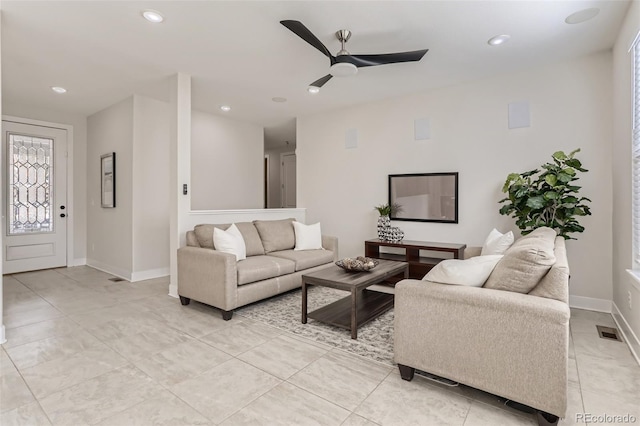 living area with visible vents, baseboards, ceiling fan, a healthy amount of sunlight, and recessed lighting