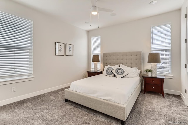 carpeted bedroom featuring ceiling fan and baseboards