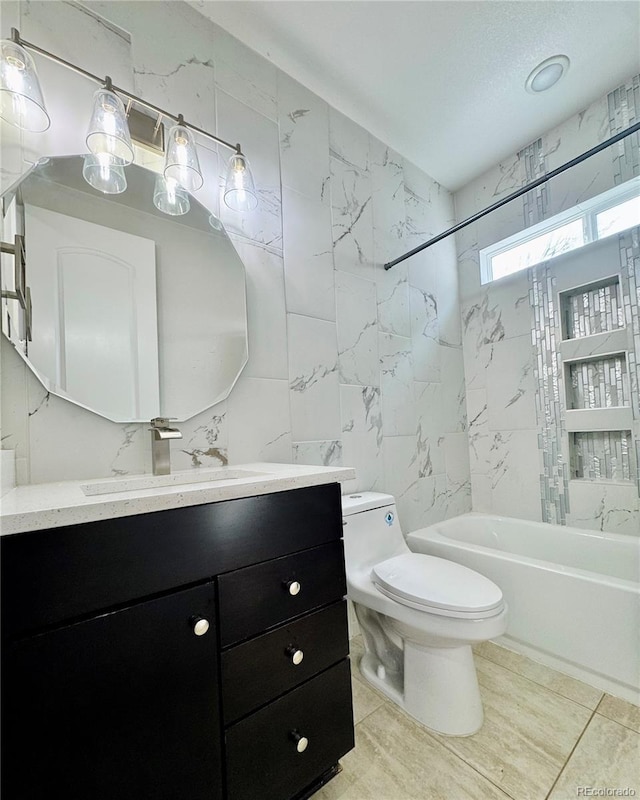 full bath with toilet,  shower combination, vanity, and tile walls