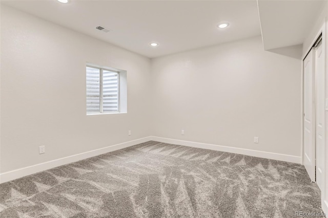 spare room featuring visible vents, baseboards, carpet flooring, and recessed lighting