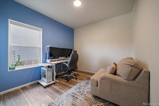home office featuring wood finished floors and baseboards