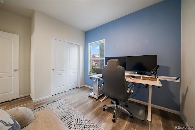 office with wood finished floors and baseboards