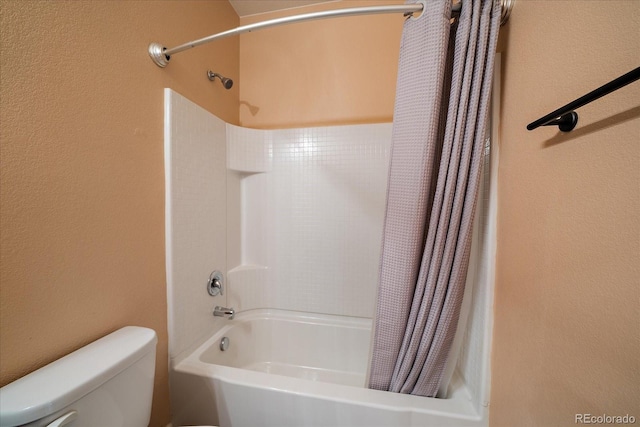 bathroom featuring toilet and shower / bathtub combination with curtain