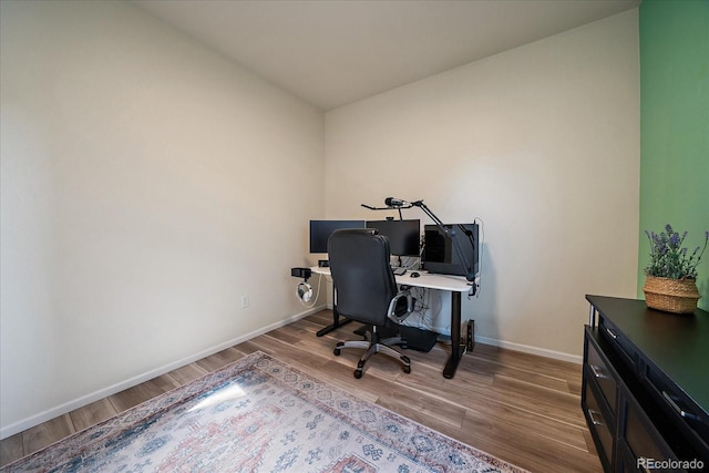 office area featuring wood finished floors and baseboards