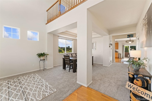 12978 Newport Way, Thornton, CO 80602 - interior space with plenty of natural light, a high ceiling, and wood finished floors