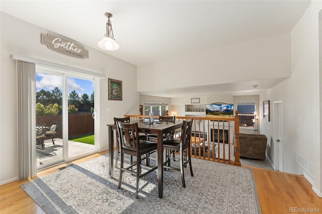 12978 Newport Way, Thornton, CO 80602 - dining area with wood finished floors and healthy amount of natural light
