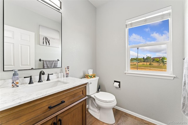12978 Newport Way, Thornton, CO 80602 - bathroom featuring wood finished floors and vanity