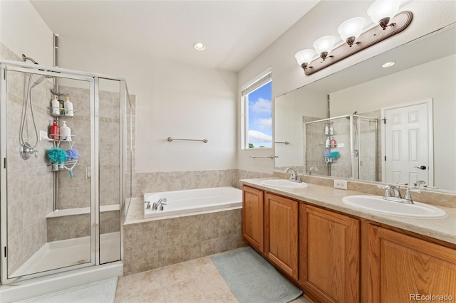 12978 Newport Way, Thornton, CO 80602 - bathroom with a garden tub, a shower stall, double vanity, and tile patterned floors