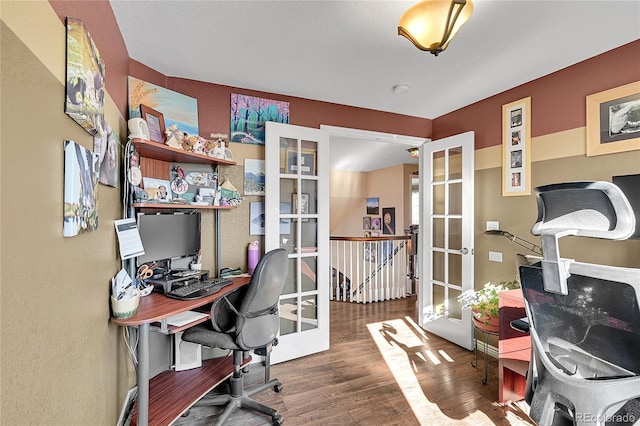 office with french doors and wood finished floors