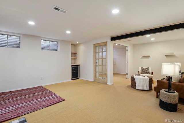 interior space featuring recessed lighting, baseboards, visible vents, and light carpet