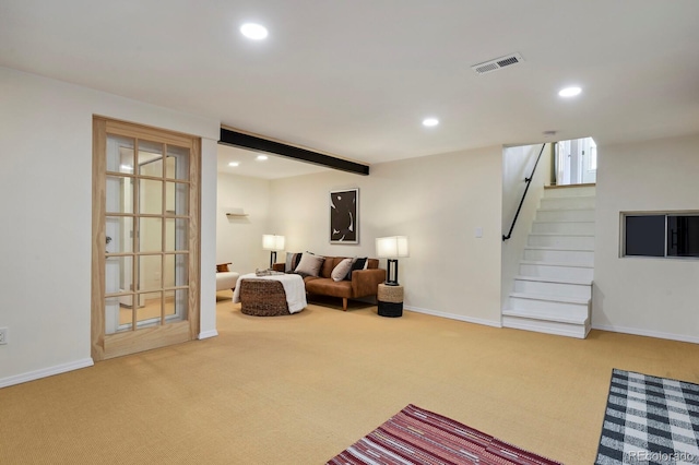 carpeted living area with recessed lighting, stairs, baseboards, and visible vents