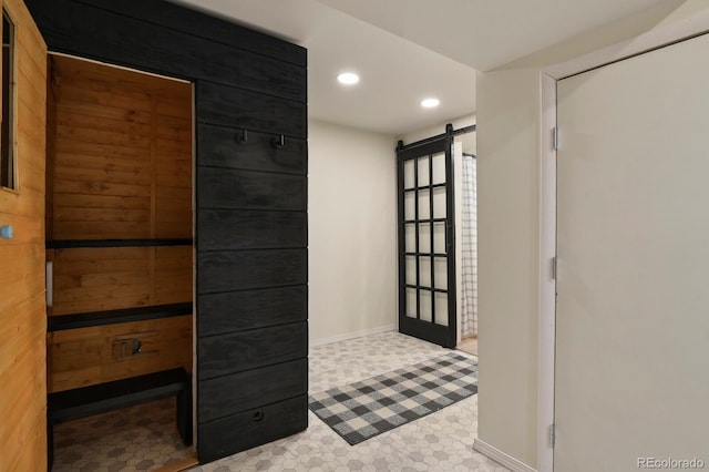 interior space featuring baseboards, a sauna, recessed lighting, and a barn door