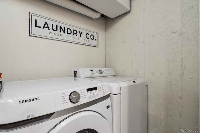 laundry room featuring laundry area and washing machine and clothes dryer