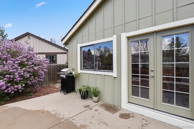 view of patio / terrace with french doors, fence, and a grill