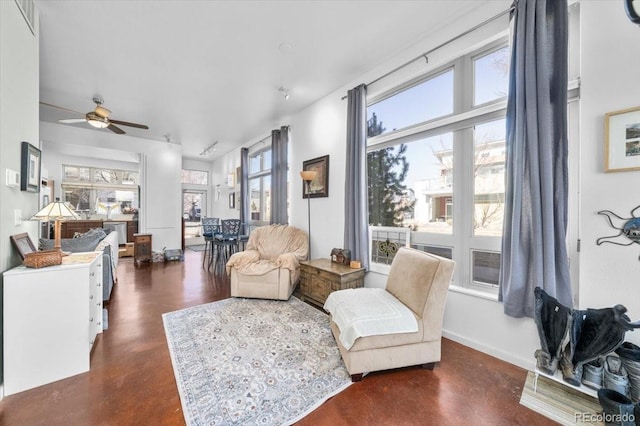 living area with ceiling fan