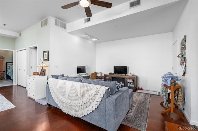 living room with track lighting and ceiling fan