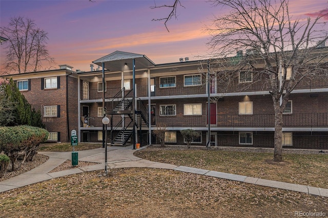 view of outdoor building at dusk