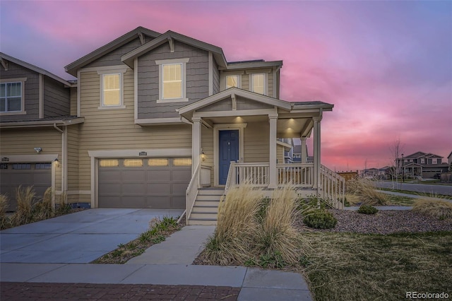 17530 E 95th Ave, Commerce City, CO 80022 - view of front of house featuring a porch, driveway, an attached garage, and stairway