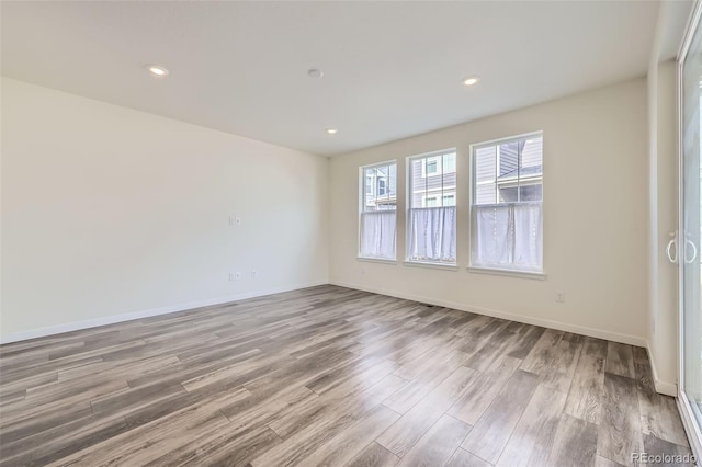 17530 E 95th Ave, Commerce City, CO 80022 - empty room with wood finished floors, baseboards, and recessed lighting