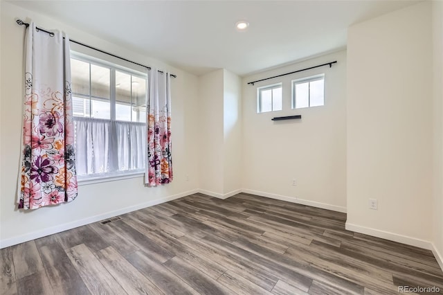 17530 E 95th Ave, Commerce City, CO 80022 - unfurnished room featuring dark wood-type flooring, baseboards, and recessed lighting