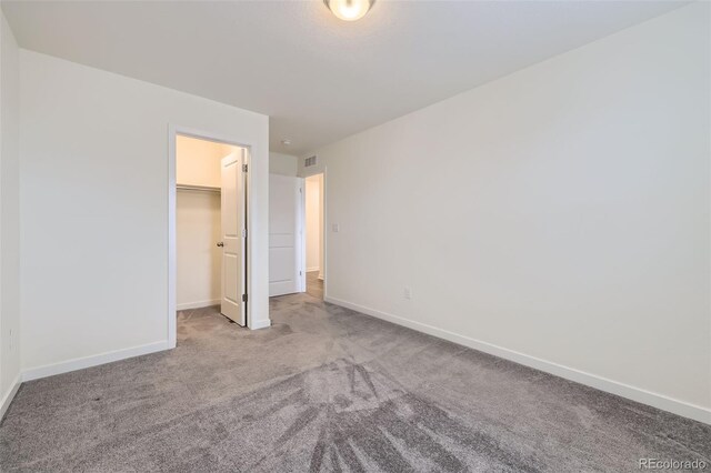 17530 E 95th Ave, Commerce City, CO 80022 - unfurnished bedroom with carpet floors, a spacious closet, baseboards, and a closet