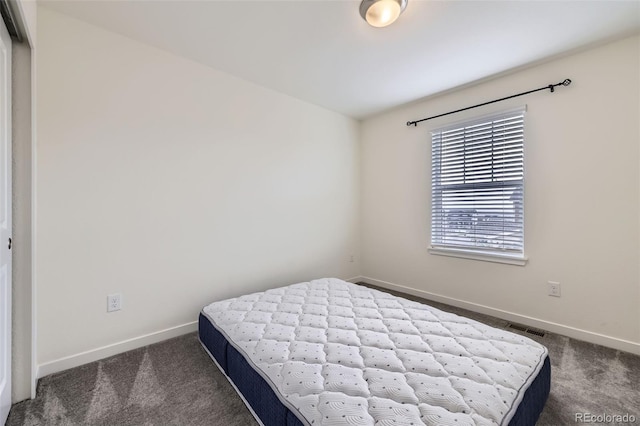 17530 E 95th Ave, Commerce City, CO 80022 - bedroom with dark carpet and baseboards