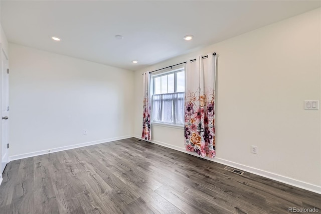17530 E 95th Ave, Commerce City, CO 80022 - spare room with dark wood finished floors, baseboards, and recessed lighting