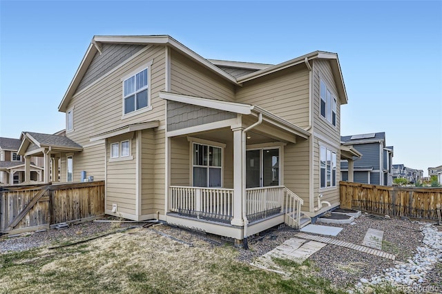 17530 E 95th Ave, Commerce City, CO 80022 - rear view of house featuring a porch and a fenced backyard