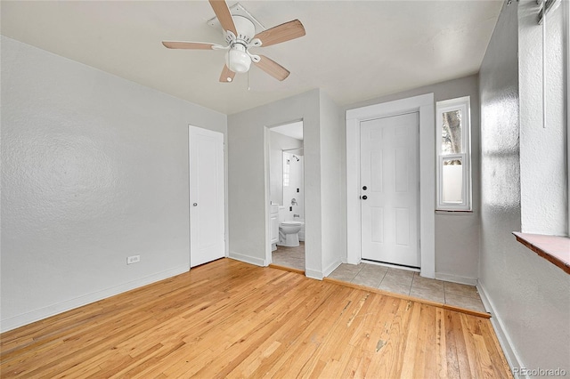 interior space featuring light hardwood / wood-style floors and ceiling fan