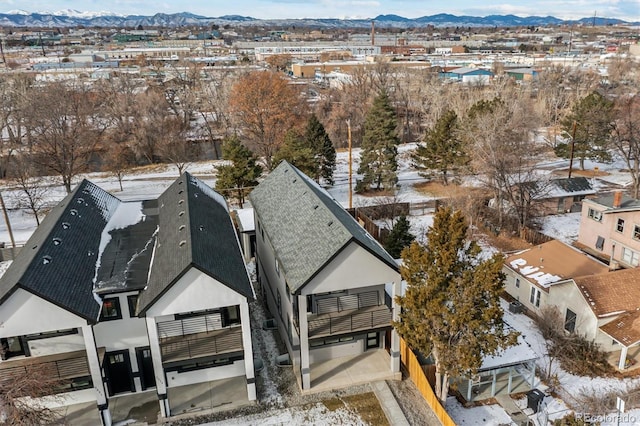 snowy aerial view featuring a mountain view