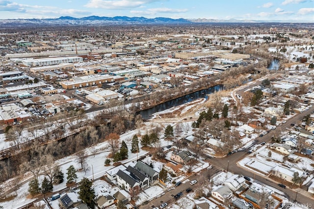 snowy aerial view with a mountain view