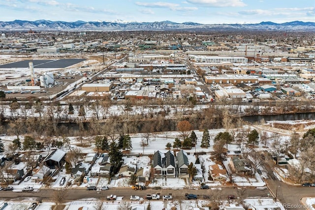 snowy aerial view featuring a mountain view