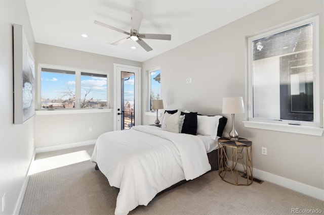 carpeted bedroom with ceiling fan and access to exterior