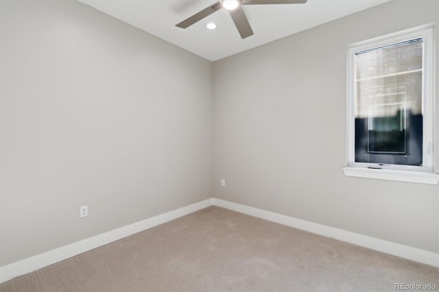 unfurnished room with ceiling fan and carpet floors