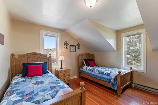 bedroom featuring hardwood / wood-style flooring, lofted ceiling, and baseboard heating