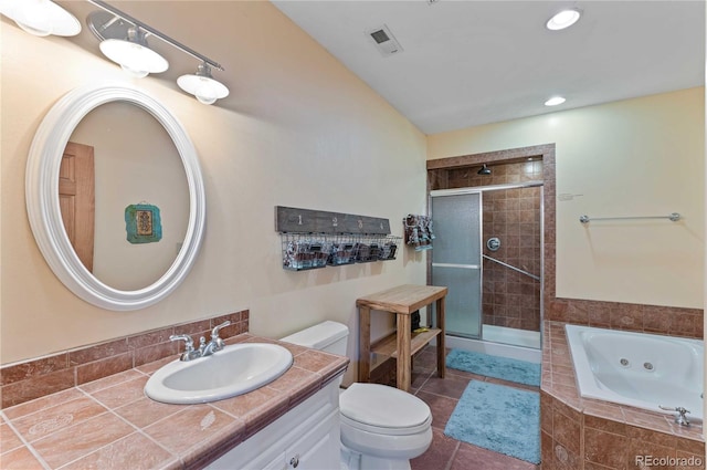 full bathroom with plus walk in shower, vanity, and toilet