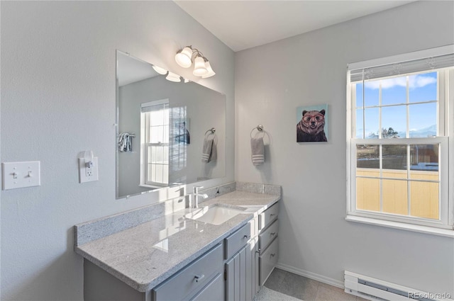 bathroom featuring tile patterned floors, vanity, and a baseboard radiator