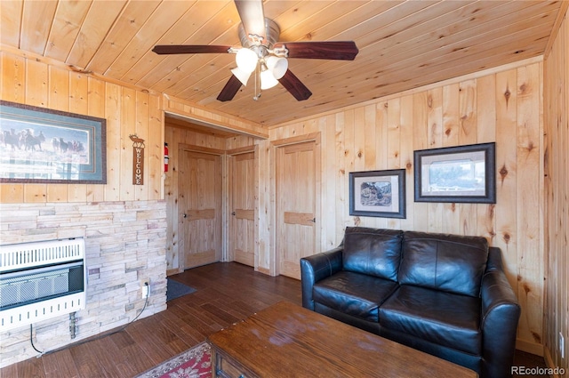 living room with wooden ceiling, dark wood-type flooring, wooden walls, and heating unit