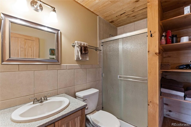 bathroom featuring wooden ceiling, tasteful backsplash, toilet, vanity, and a shower with shower door