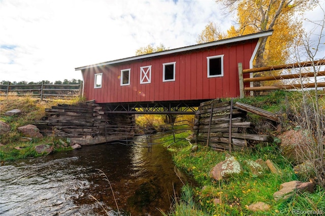 view of outbuilding featuring a water view