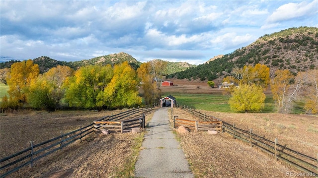 view of road with a mountain view and a rural view