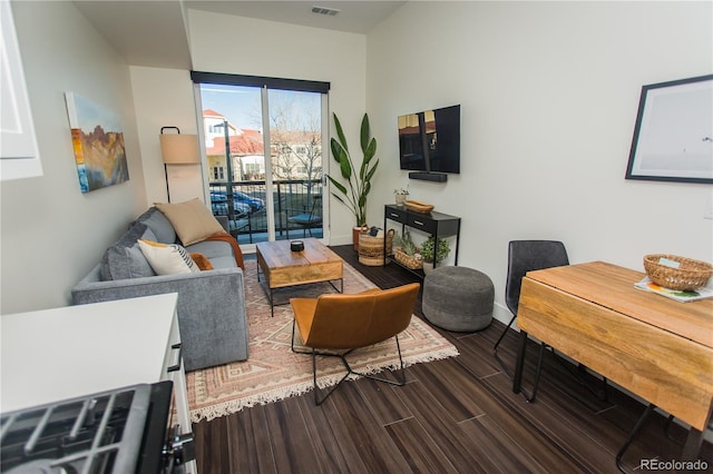 2876 W 53rd Ave Unit 106, Denver, CO 80221 - living room featuring baseboards and wood finished floors