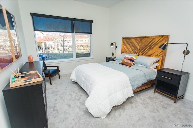 2876 W 53rd Ave Unit 106, Denver, CO 80221 - bedroom featuring light carpet and baseboards