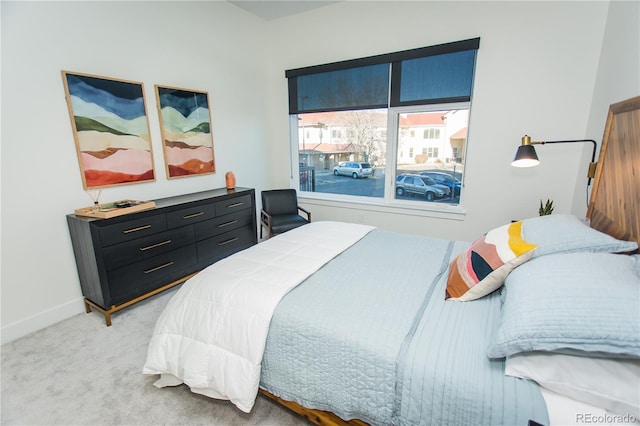 2876 W 53rd Ave Unit 106, Denver, CO 80221 - bedroom with light carpet and baseboards