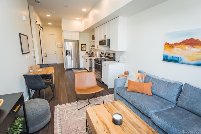 2876 W 53rd Ave Unit 106, Denver, CO 80221 - living area featuring dark wood finished floors, recessed lighting, and a barn door