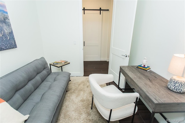 2876 W 53rd Ave Unit 106, Denver, CO 80221 - office area featuring a barn door, wood finished floors, and baseboards