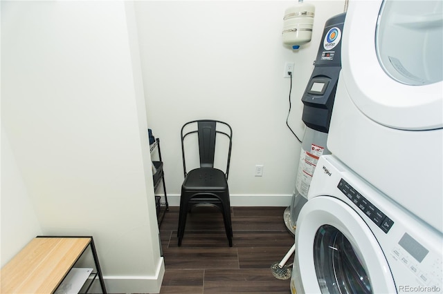 2876 W 53rd Ave Unit 106, Denver, CO 80221 - laundry room featuring stacked washer / drying machine, baseboards, and dark wood-style floors