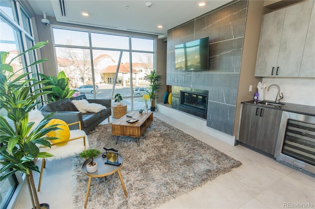 2876 W 53rd Ave Unit 106, Denver, CO 80221 - living room with beverage cooler, recessed lighting, a tile fireplace, and light tile patterned flooring